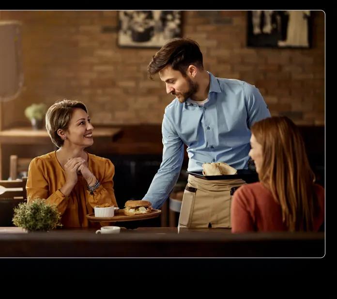 a man and two women talking