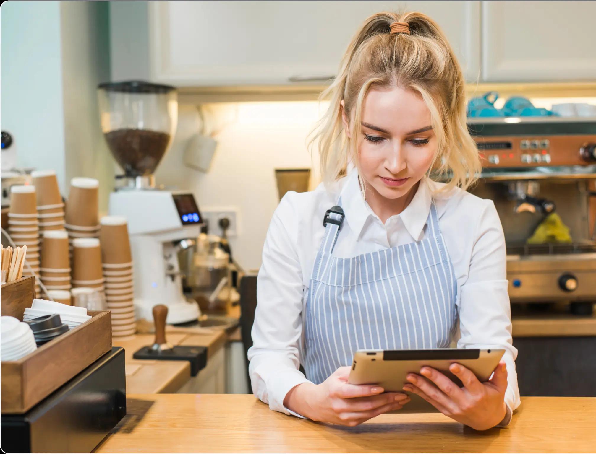 a waiter using a tablet